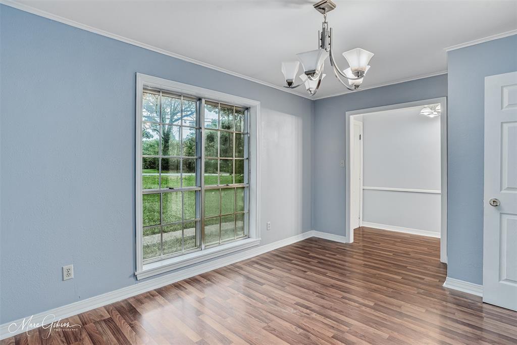 3112 Gorton Road Shreveport, LA 71119 - Photo 5 of 19 a view of an empty room with wooden floor and a window