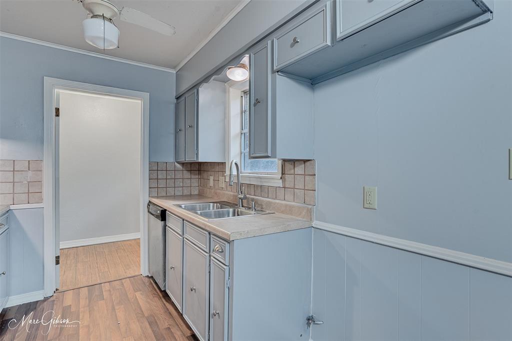 3112 Gorton Road Shreveport, LA 71119 - Photo 7 of 19 a kitchen with a sink cabinets and wooden floor