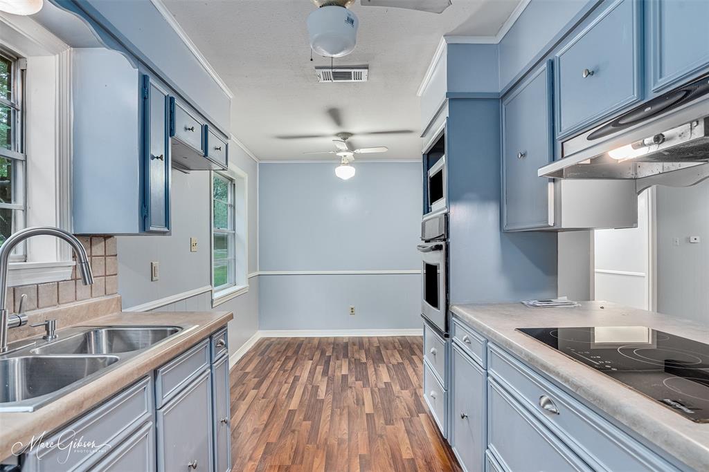 3112 Gorton Road Shreveport, LA 71119 - Photo 9 of 19 a kitchen with a sink and refrigerator