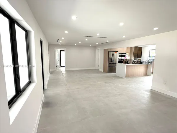 a view of a kitchen with a sink