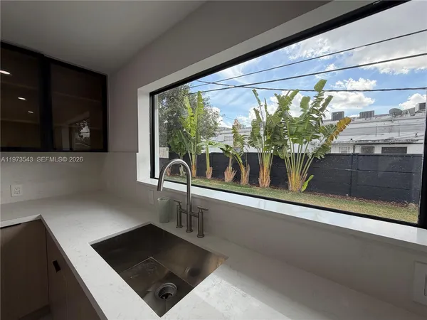 a view of a livingroom with furniture and windows