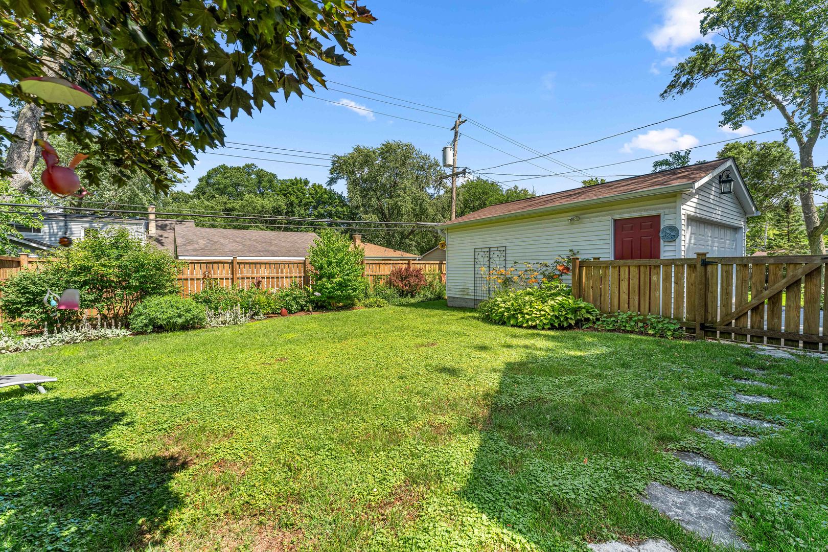 725 North County Line Road Hinsdale, IL 60521 - Photo 27 of 34 a view of a house with backyard and garden