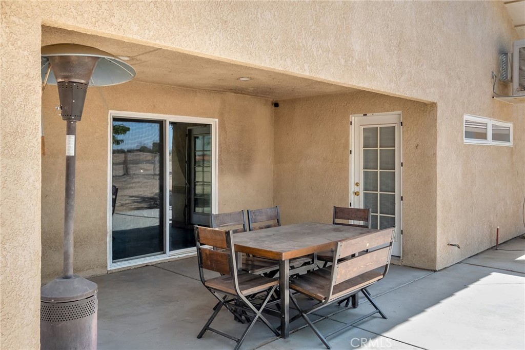 14952 Rivers Edge Road Helendale, CA 92342 - Photo 30 of 33 a view of a dining room with furniture and wooden floor