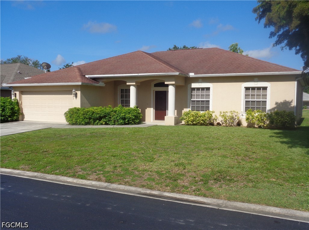 2463 Nature Pointe Loop Fort Myers, FL 33905 - Photo 3 of 50 a front view of a house with garden