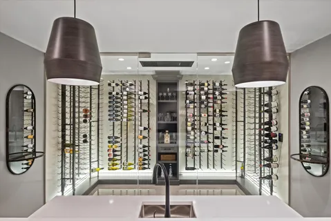 a large kitchen with stainless steel appliances kitchen island granite countertop a refrigerator and a sink