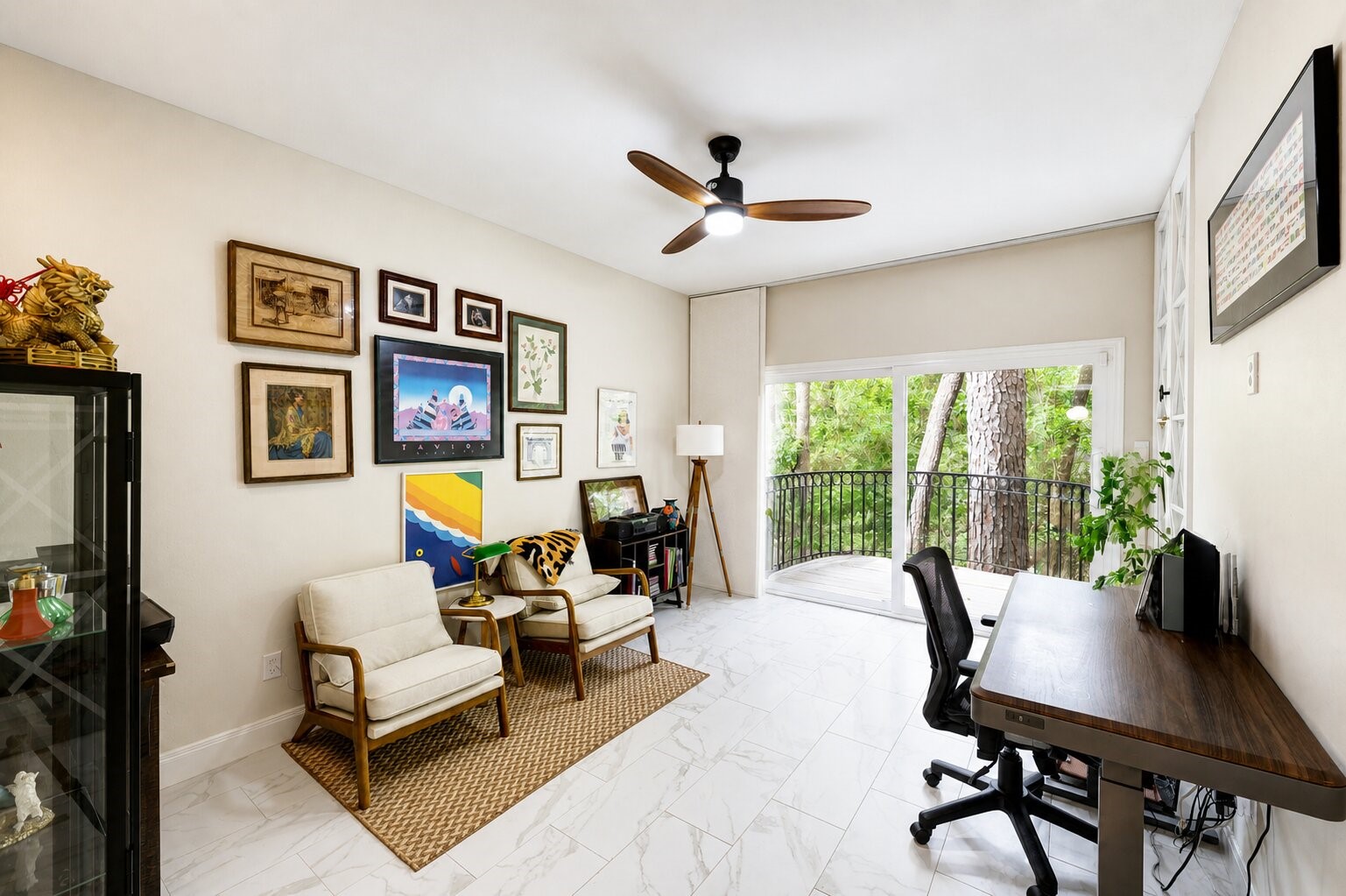 201 Vanderpool Lane, Unit 130 Houston, TX 77024 - Photo 19 of 41 This space can function as a bedroom or home office and features dual built-in shelving units behind glass doors. The rear 8'-wide glass sliding door leads to one of the elevated balcony seating areas.