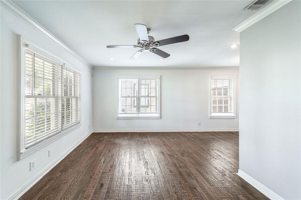 7302 Kenwell Street Dallas, TX 75209 - Photo 16 of 29 a view of an empty room with wooden floor and a window