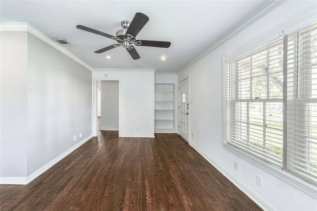 7302 Kenwell Street Dallas, TX 75209 - Photo 17 of 29 a view of an empty room with wooden floor and a window