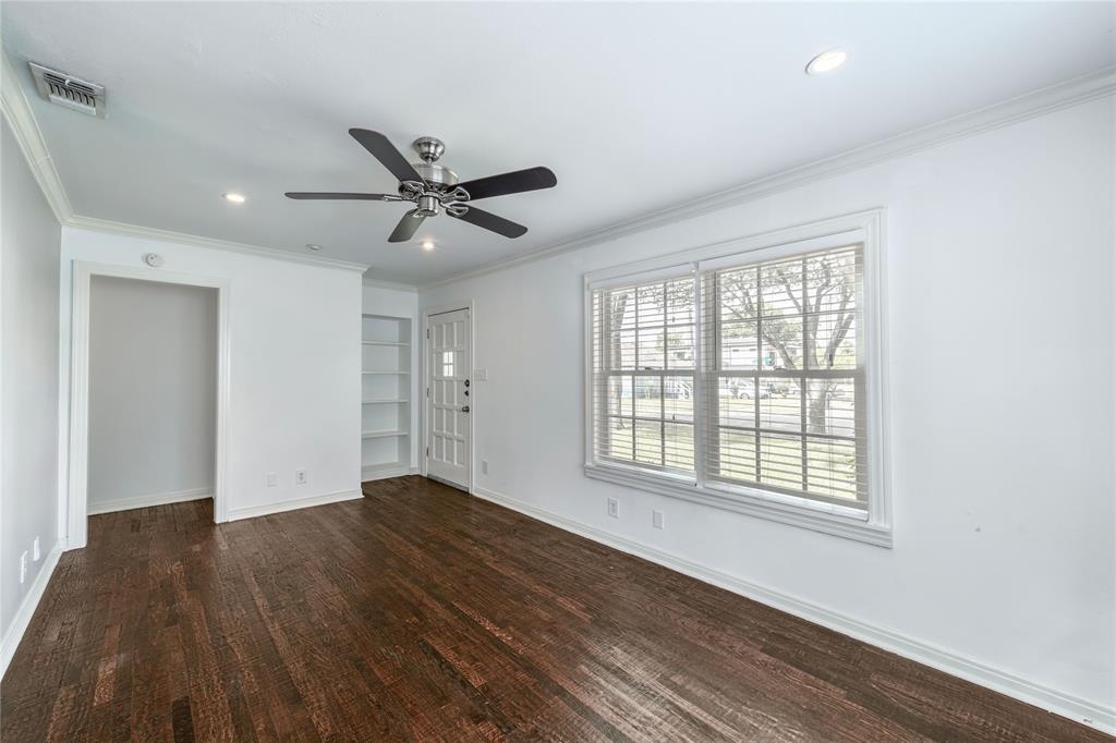 7302 Kenwell Street Dallas, TX 75209 - Photo 18 of 29 a view of an empty room with wooden floor and a window