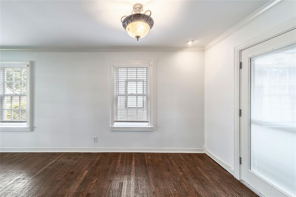 7302 Kenwell Street Dallas, TX 75209 - Photo 19 of 29 an empty room with wooden floor and windows
