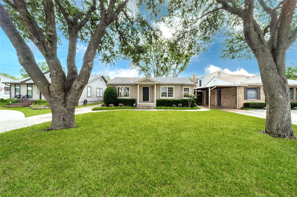 7302 Kenwell Street Dallas, TX 75209 - Photo 2 of 29 a front view of a house with garden