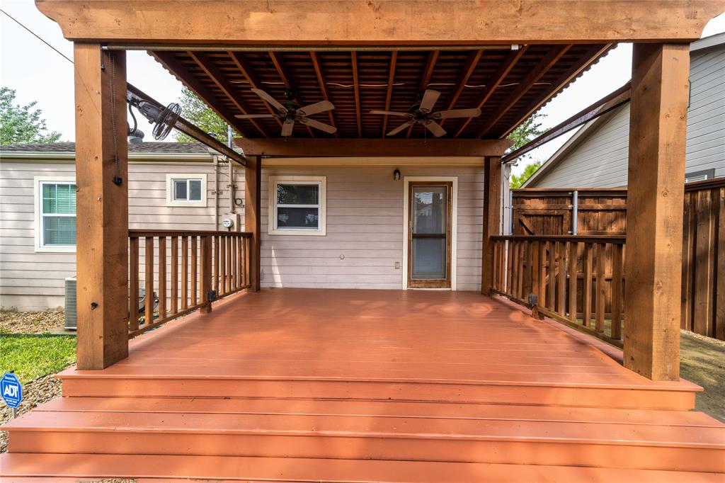 7302 Kenwell Street Dallas, TX 75209 - Photo 22 of 29 a view of backyard with wooden deck and seating space
