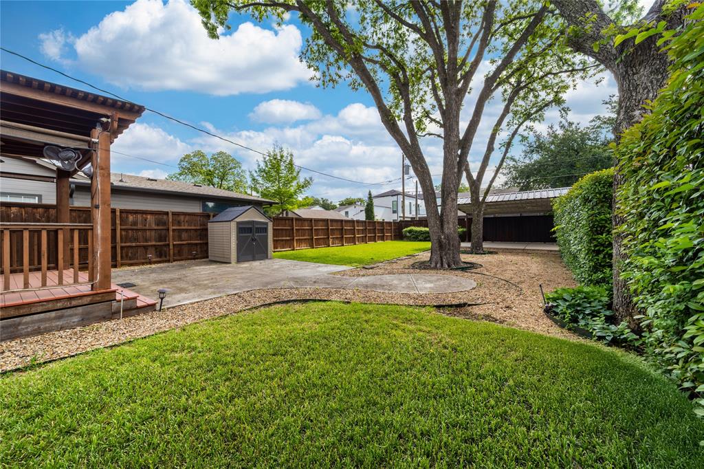 7302 Kenwell Street Dallas, TX 75209 - Photo 26 of 29 a view of a house with backyard and a tree