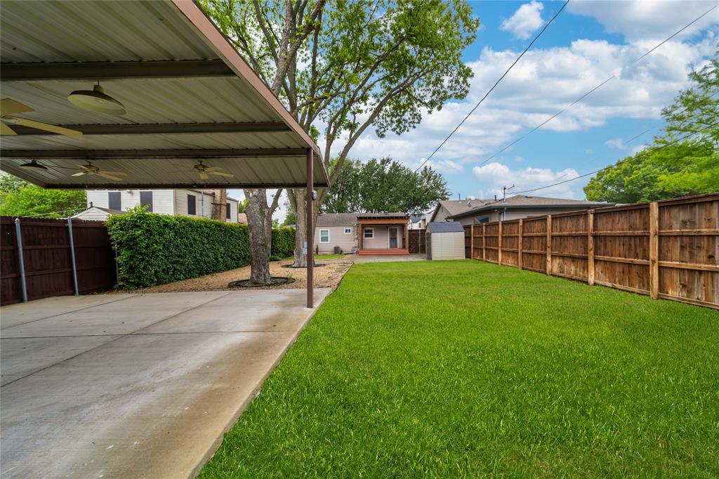 7302 Kenwell Street Dallas, TX 75209 - Photo 27 of 29 a view of a backyard with a garden and plants