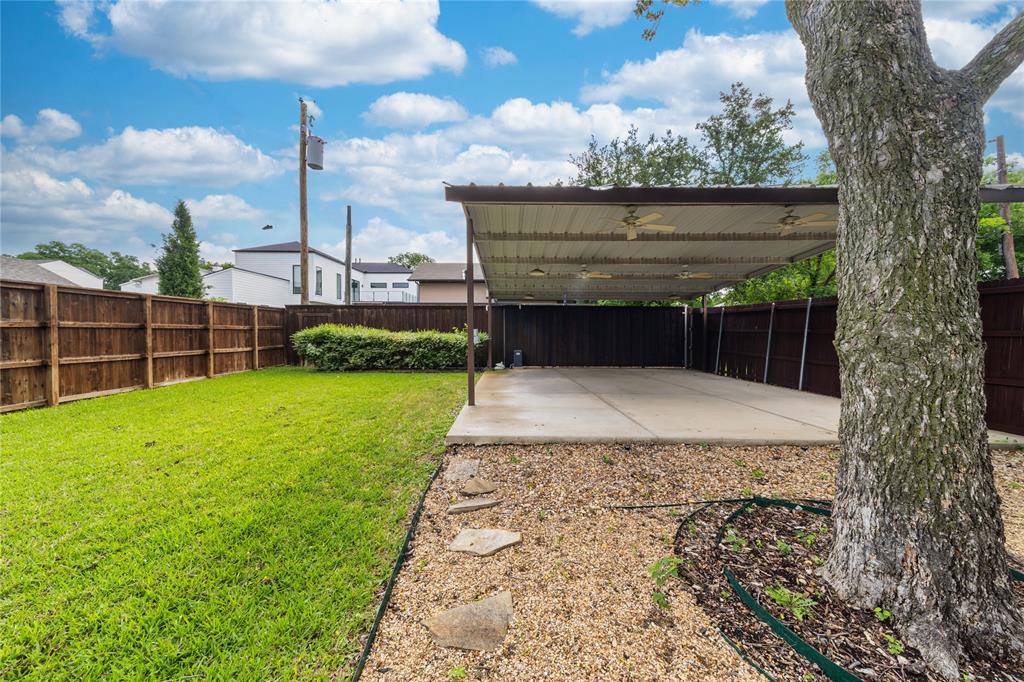 7302 Kenwell Street Dallas, TX 75209 - Photo 29 of 29 a view of a garden with a wooden fence
