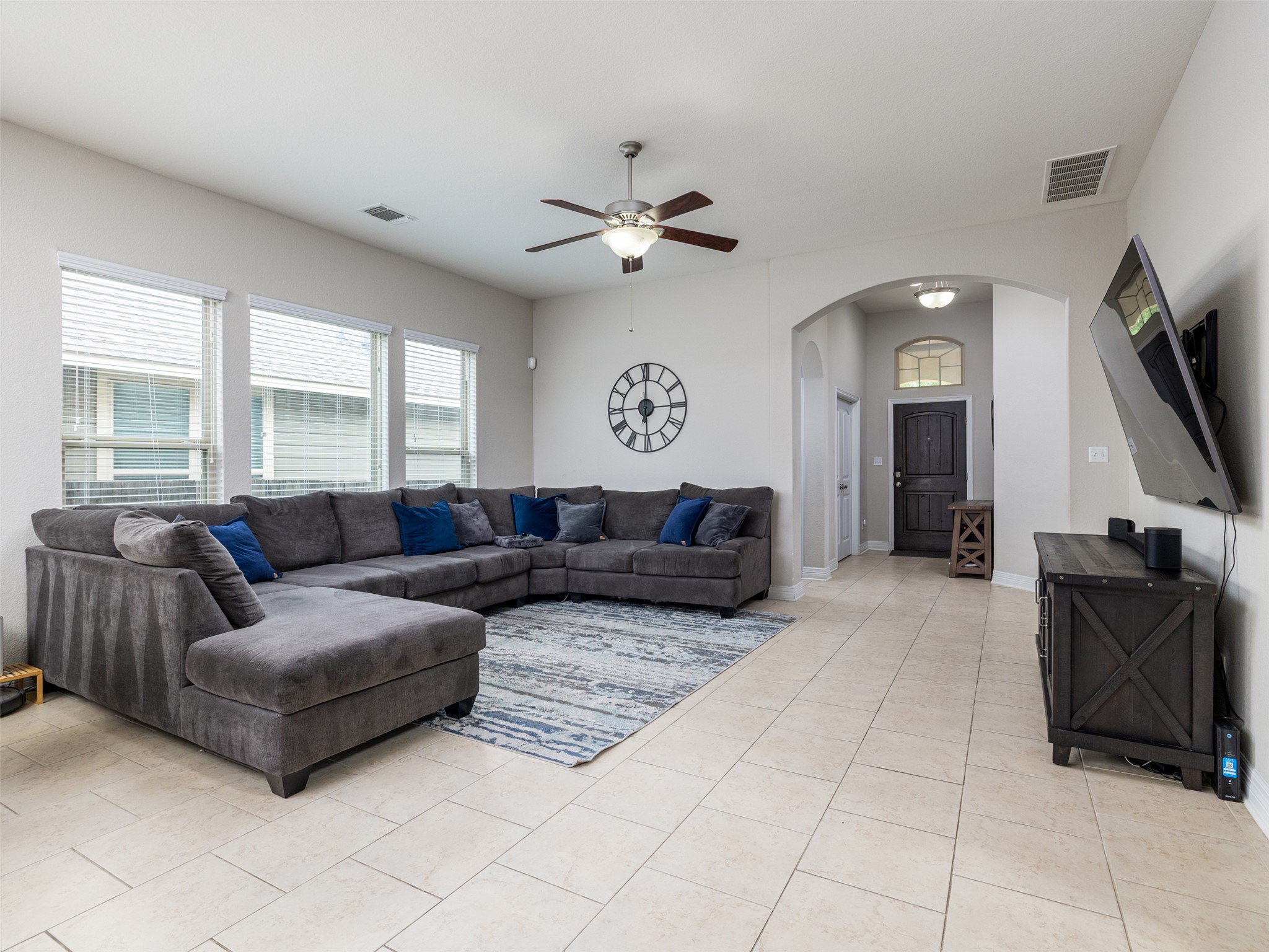 717 Blue Agave Lane Georgetown, TX 78626 - Photo 6 of 28 a living room with furniture and a flat screen tv