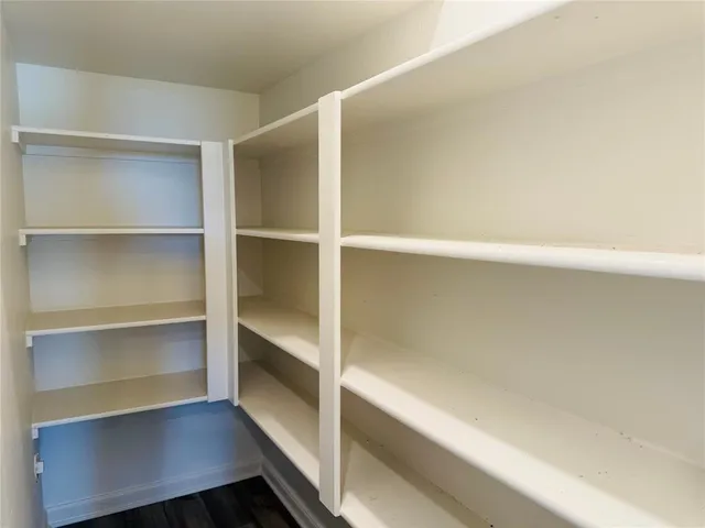 a hallway with walk in closet