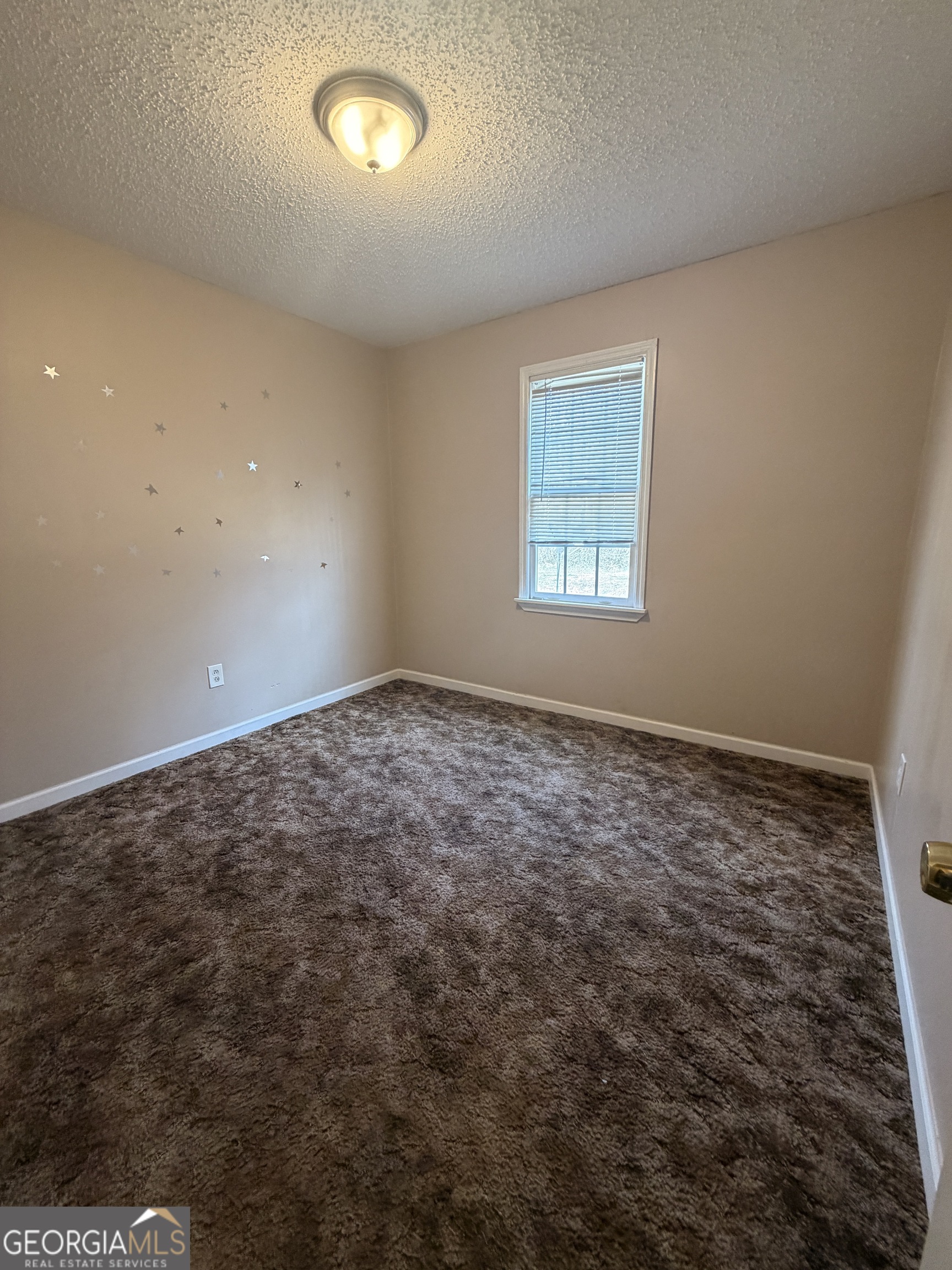 4951 Martin Farms Road Powder Springs, GA 30127 - Photo 4 of 9 an empty room with a empty space and window