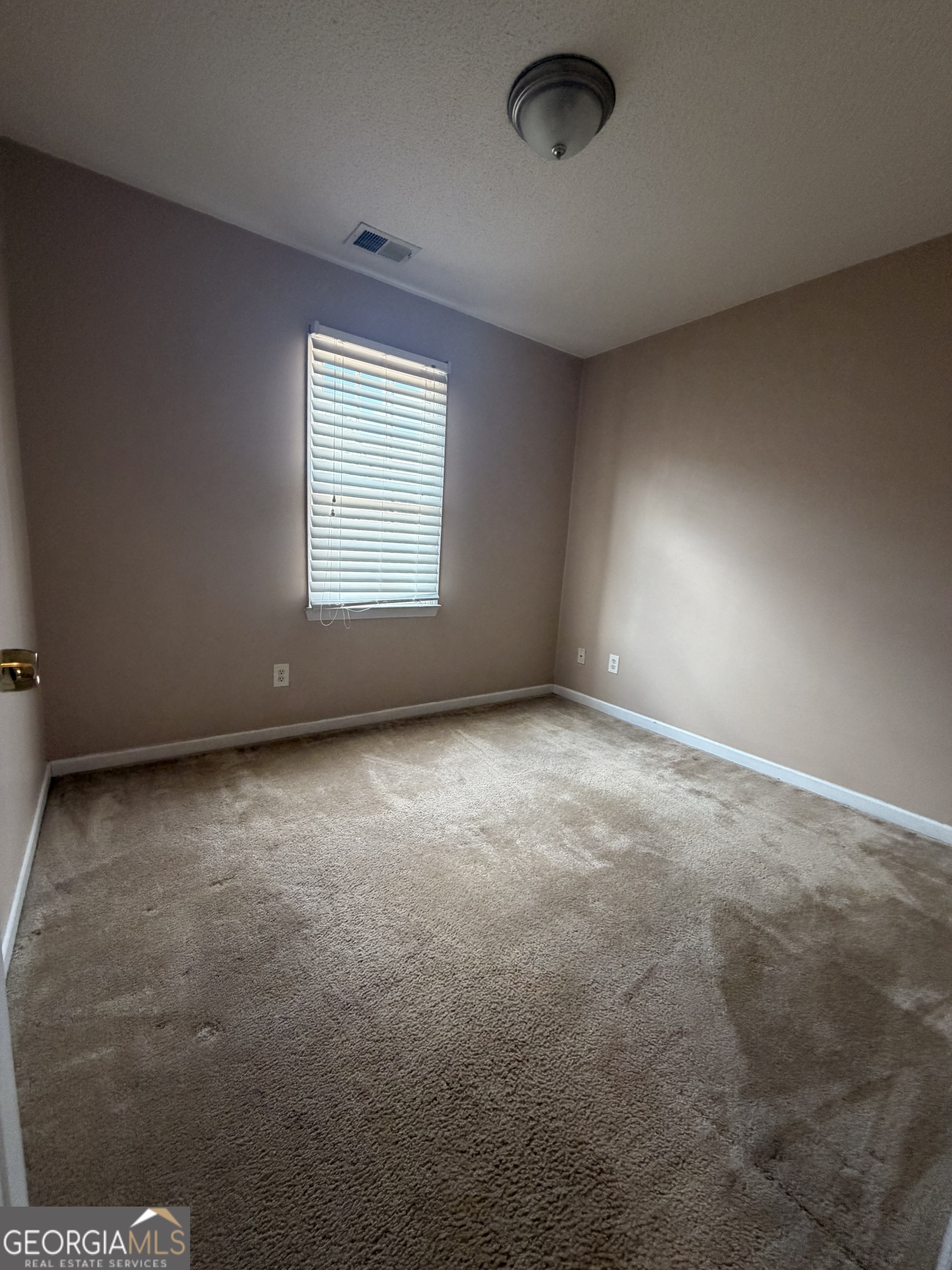 4951 Martin Farms Road Powder Springs, GA 30127 - Photo 5 of 9 an empty room with a empty space and windows