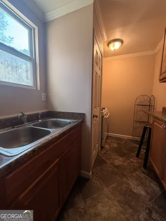 a view of a sink and a window