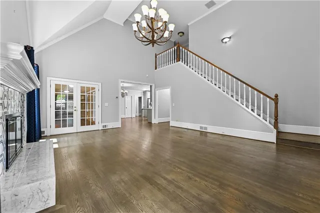 a view of an entryway with wooden floor