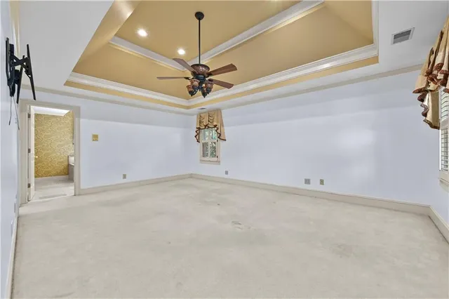 a view of an empty room with a chandelier