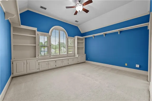 a bathroom with a granite countertop sink a toilet and shower