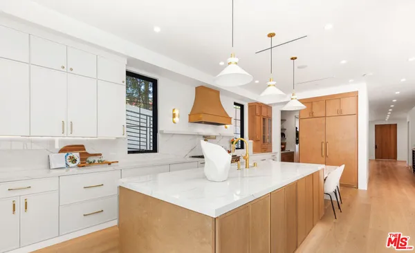 a kitchen with a sink and a window