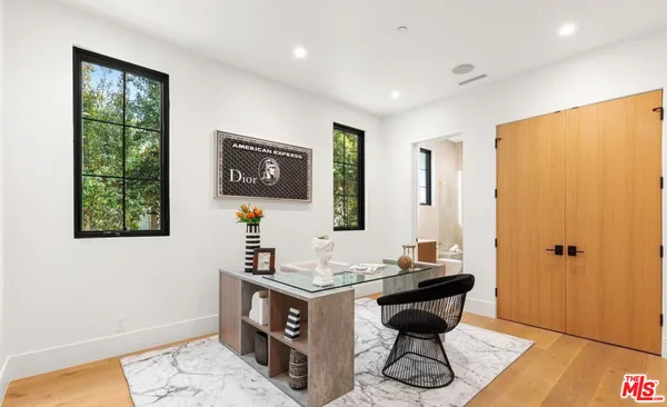 a bathroom with a sink vanity and a mirror