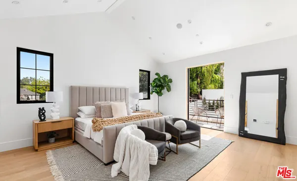 a bathroom with a tub shower and sink