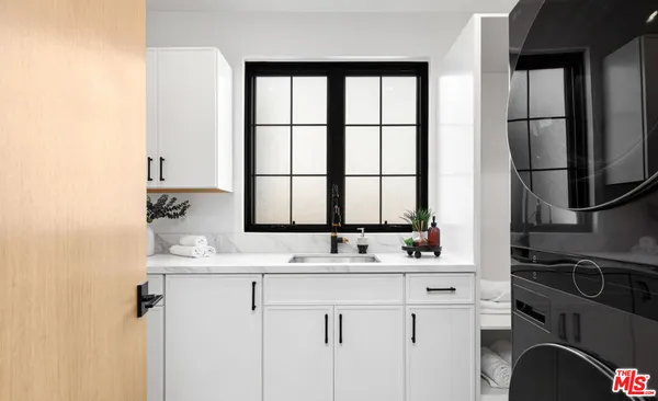 a bedroom with a large bed and a large window