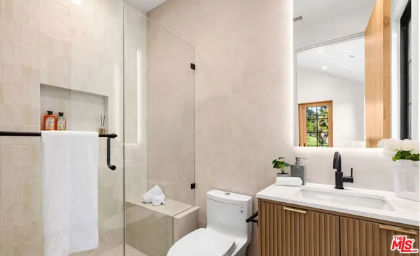 a bedroom with a large bed and a large window