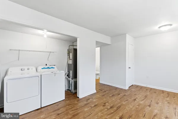 a view of a storage & utility room with washer and dryer