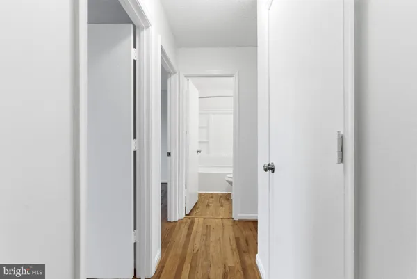 a view of a bathroom from a hallway