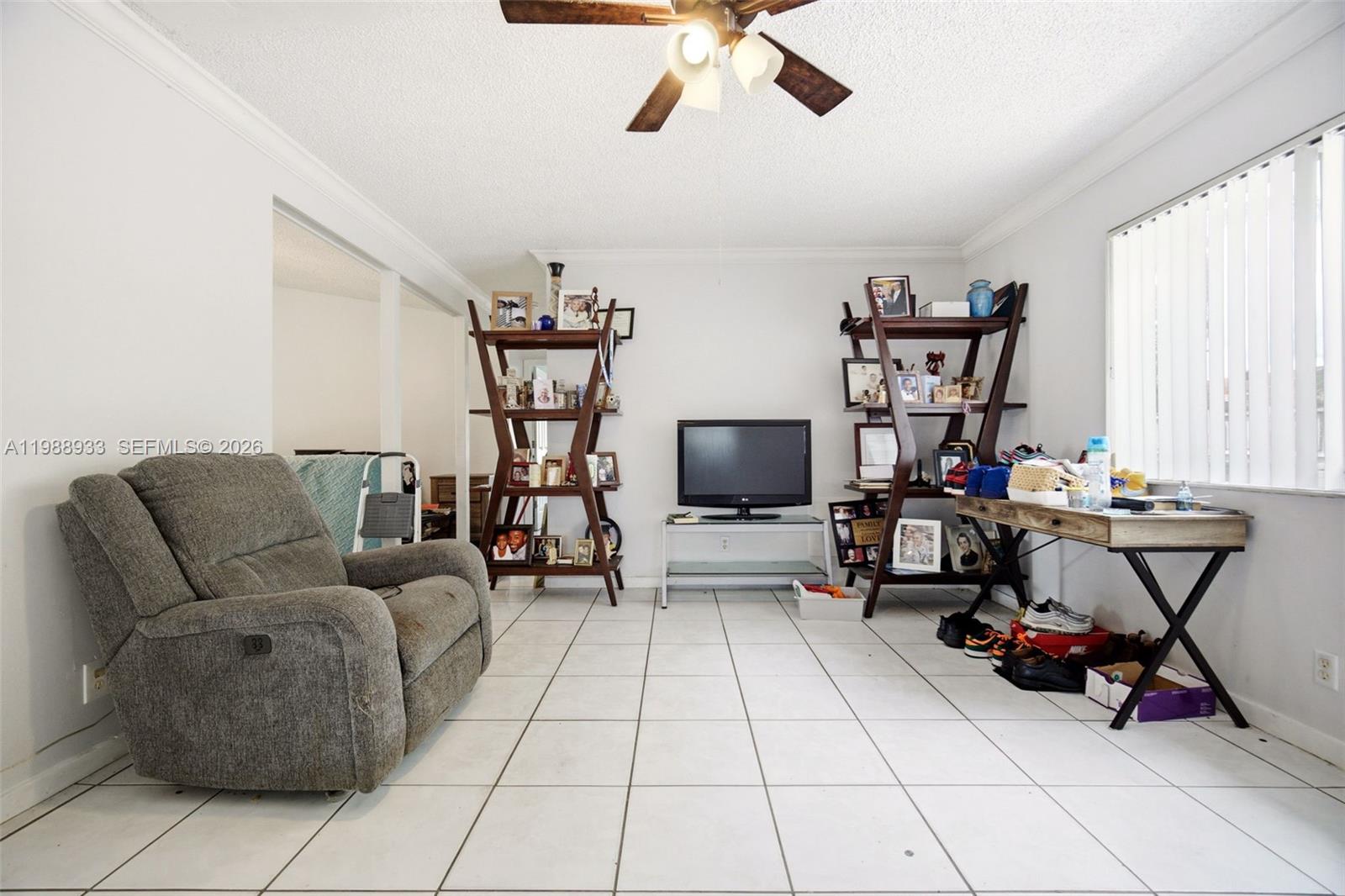 841 Southwest 55th Avenue Margate, FL 33068 - Photo 19 of 26 a living room with furniture and a flat screen tv