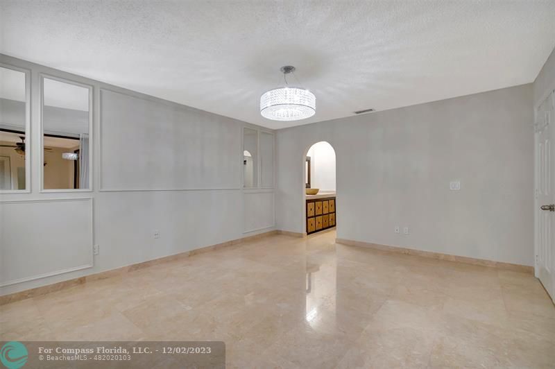 9268 Sable Ridge Circle, Unit C Boca Raton, FL 33428 - Photo 26 of 50 an empty room with entrance and mirror