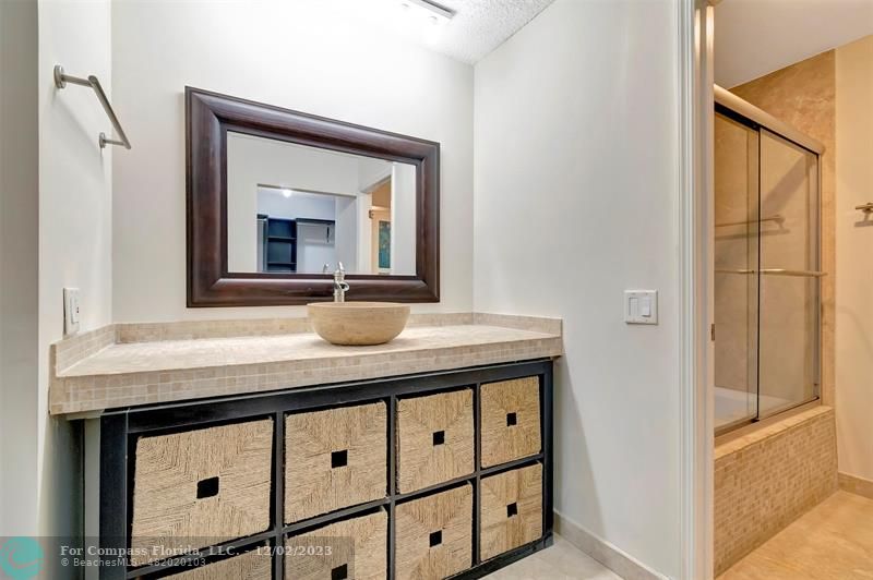 9268 Sable Ridge Circle, Unit C Boca Raton, FL 33428 - Photo 27 of 50 a bathroom with a sink a vanity and a mirror