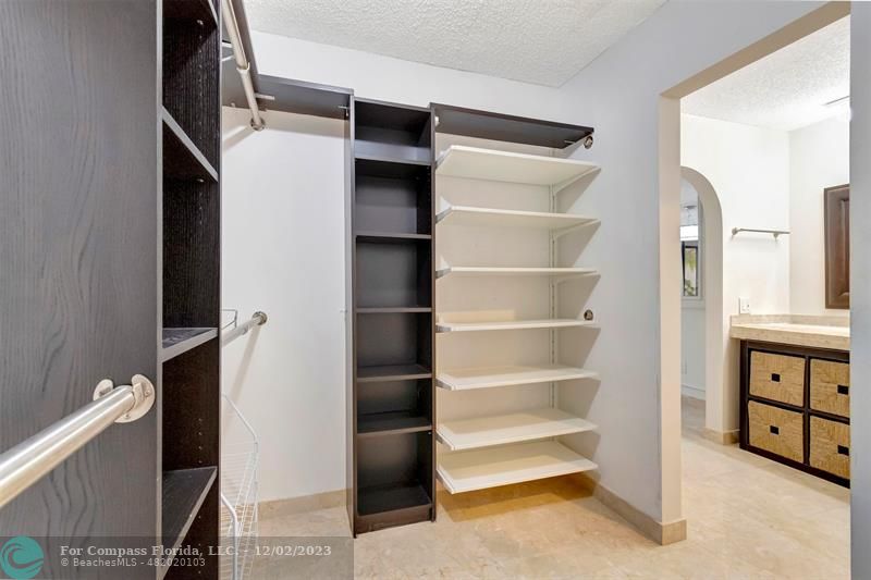 9268 Sable Ridge Circle, Unit C Boca Raton, FL 33428 - Photo 29 of 50 a view of walk in closet with empty racks