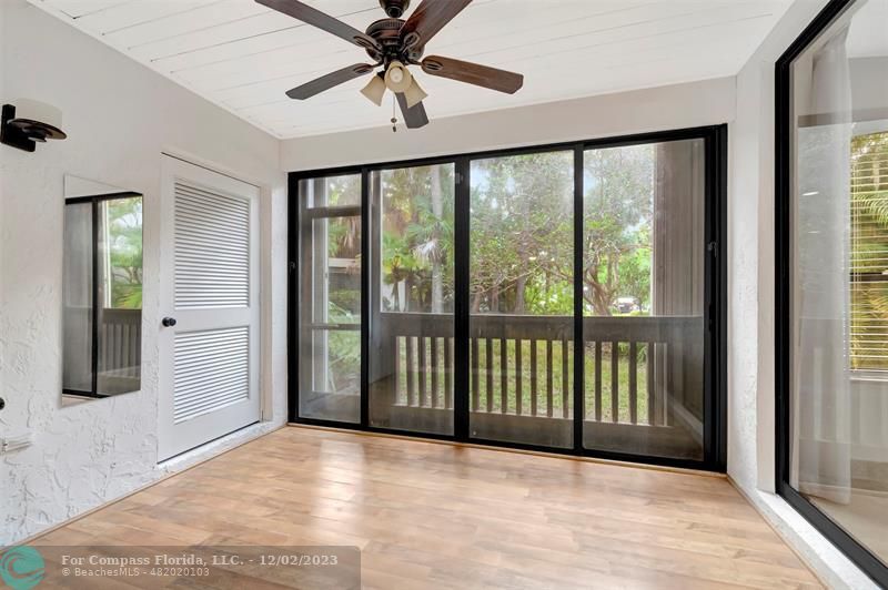 9268 Sable Ridge Circle, Unit C Boca Raton, FL 33428 - Photo 36 of 50 a view of a big room with wooden floor and windows