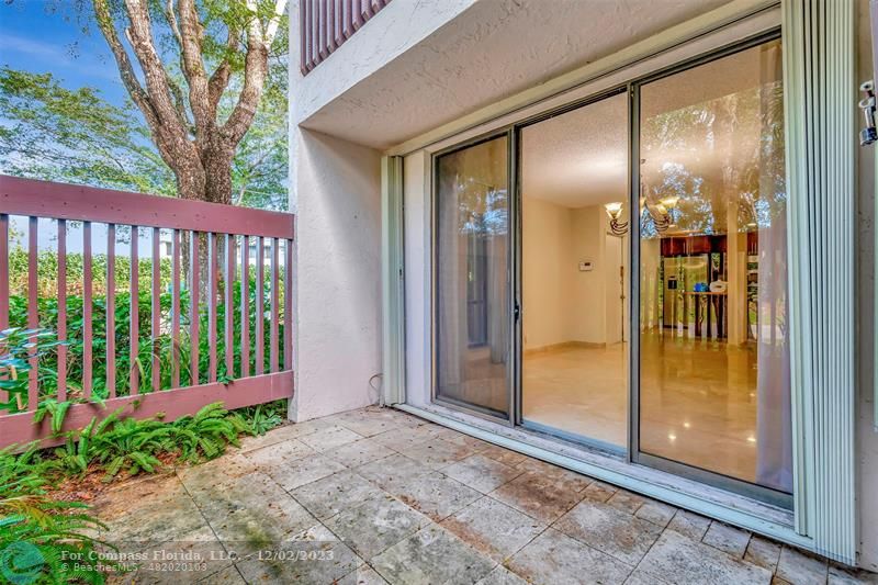 9268 Sable Ridge Circle, Unit C Boca Raton, FL 33428 - Photo 38 of 50 a view of backyard with porch
