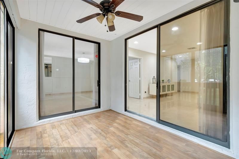 9268 Sable Ridge Circle, Unit C Boca Raton, FL 33428 - Photo 4 of 50 a view of a bathroom with a glass shower door and a mirror