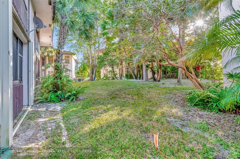 9268 Sable Ridge Circle, Unit C Boca Raton, FL 33428 - Photo 41 of 50 a view of a yard in front of a building
