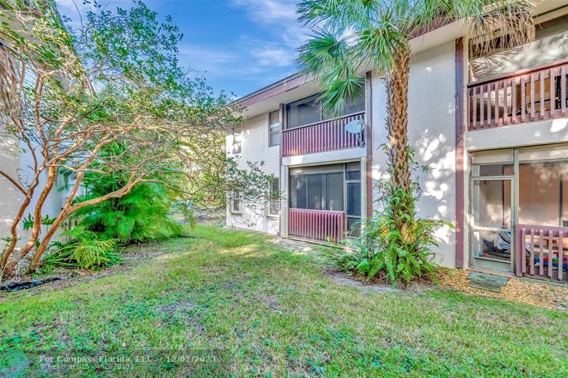9268 Sable Ridge Circle, Unit C Boca Raton, FL 33428 - Photo 42 of 50 a front view of a house with garden