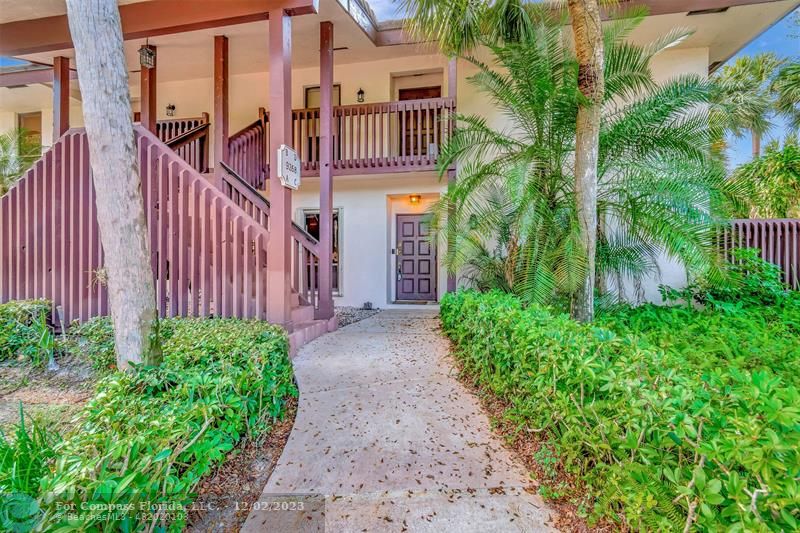 9268 Sable Ridge Circle, Unit C Boca Raton, FL 33428 - Photo 48 of 50 a front view of a house with balcony