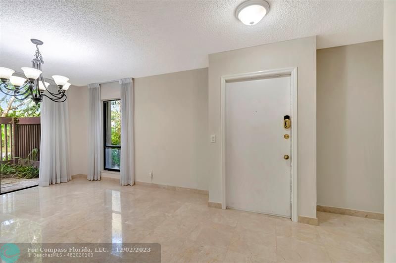 9268 Sable Ridge Circle, Unit C Boca Raton, FL 33428 - Photo 9 of 50 wooden floor in an empty room with a window