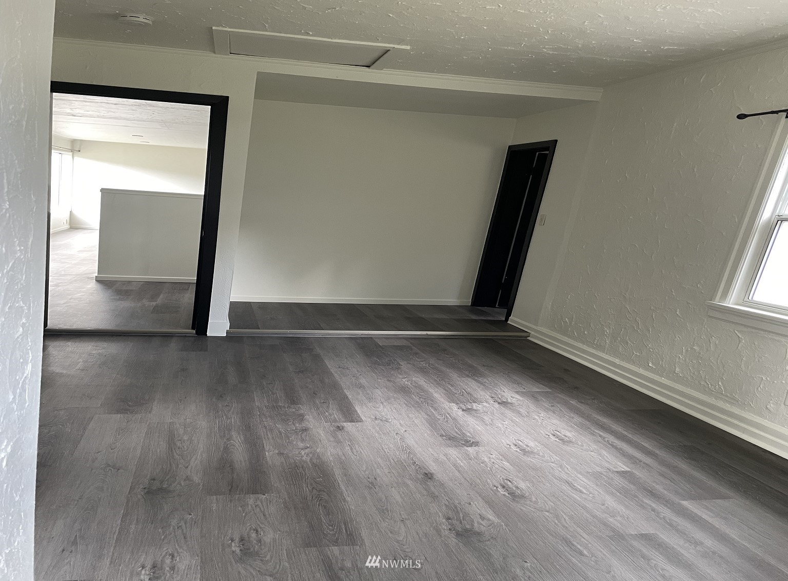 15346 Southeast May Valley Road Renton, WA 98059 - Photo 15 of 26 a view of a livingroom with wooden floor