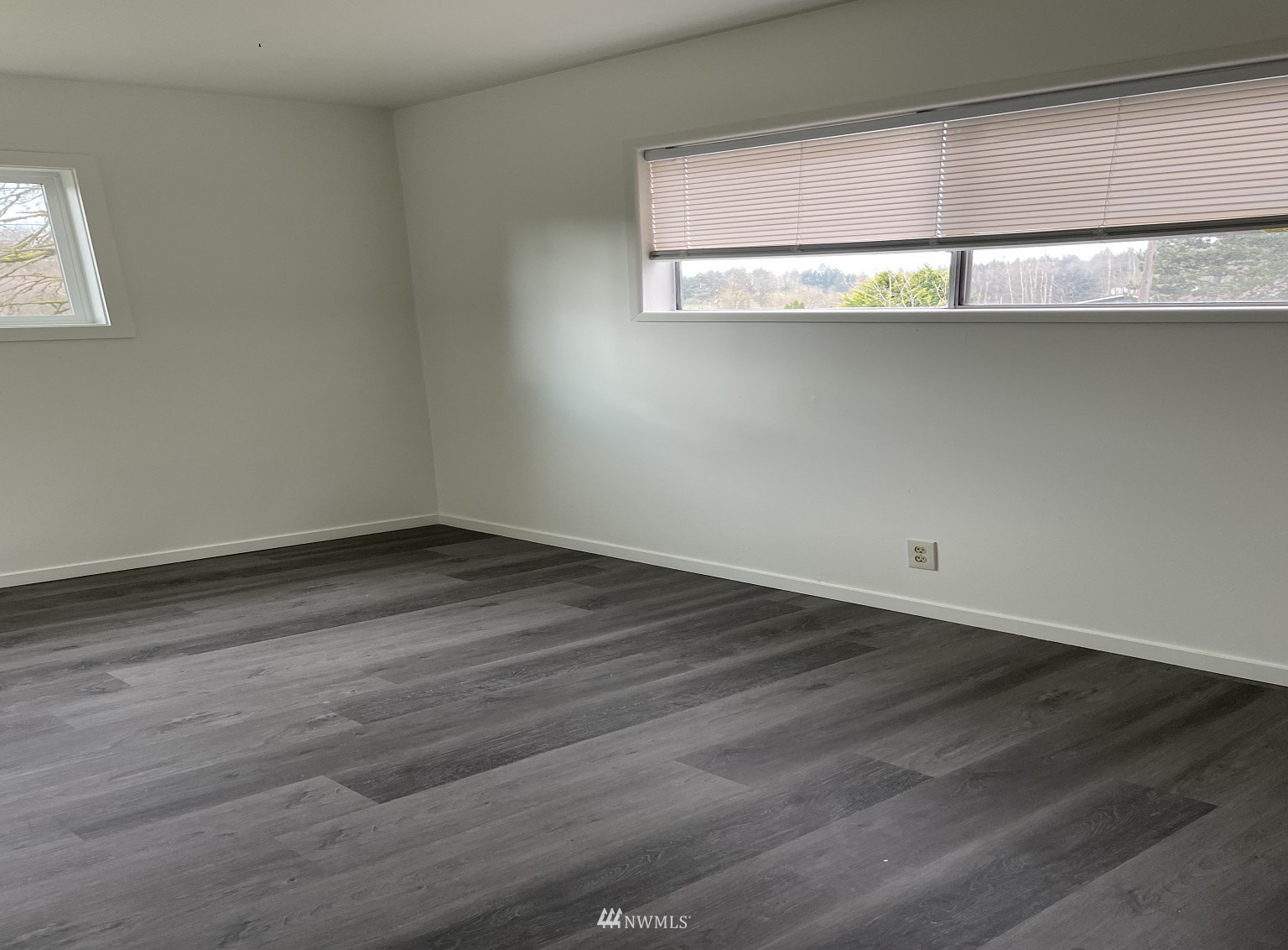 15346 Southeast May Valley Road Renton, WA 98059 - Photo 18 of 26 a view of a small space with wooden floor and a window