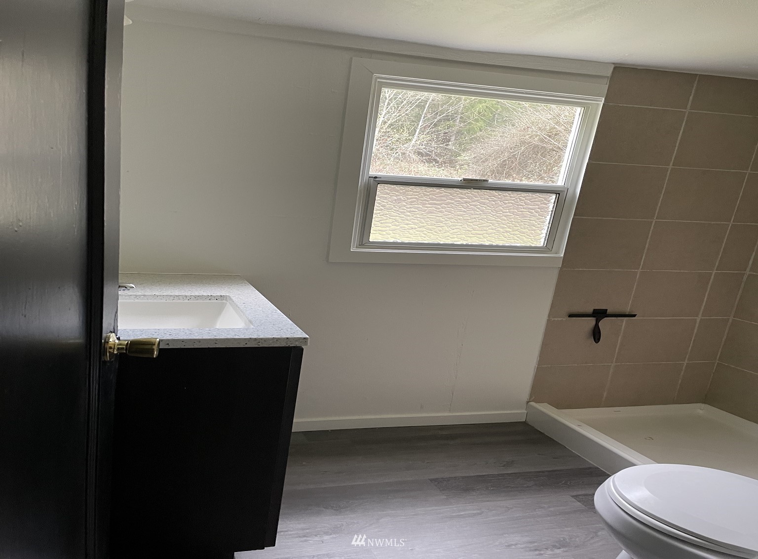 15346 Southeast May Valley Road Renton, WA 98059 - Photo 20 of 26 a bathroom with a sink toilet and shower