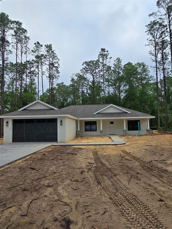 1683 West Pearson Street Hernando, FL 34442 - Photo 1 of 4 front view of house with a yard