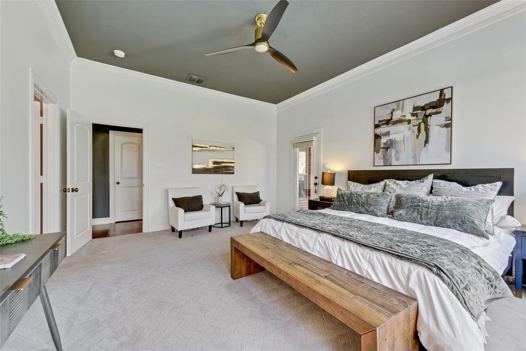 15 Falcons View Pass Heath, TX 75032 - Photo 16 of 38 a spacious bedroom with a bed and ceiling fan